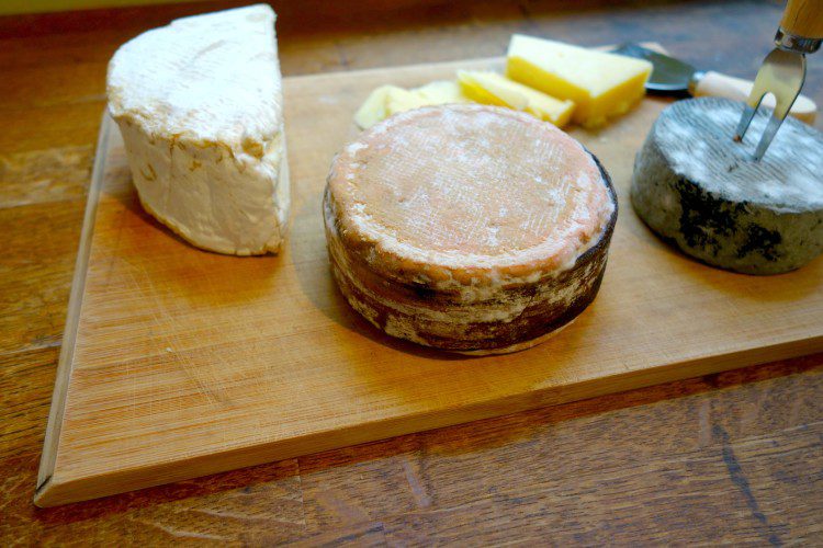 different cheese on wooden board