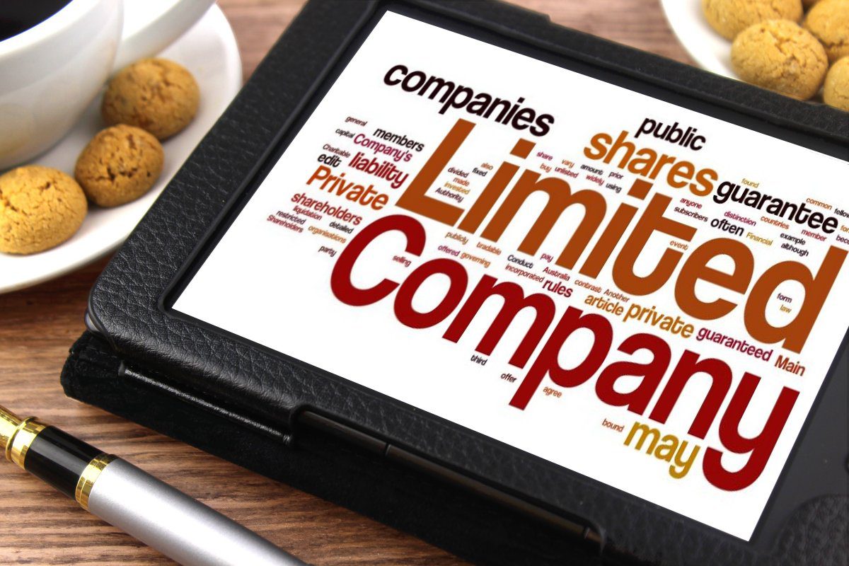business words on tablet with limited company in larger letters