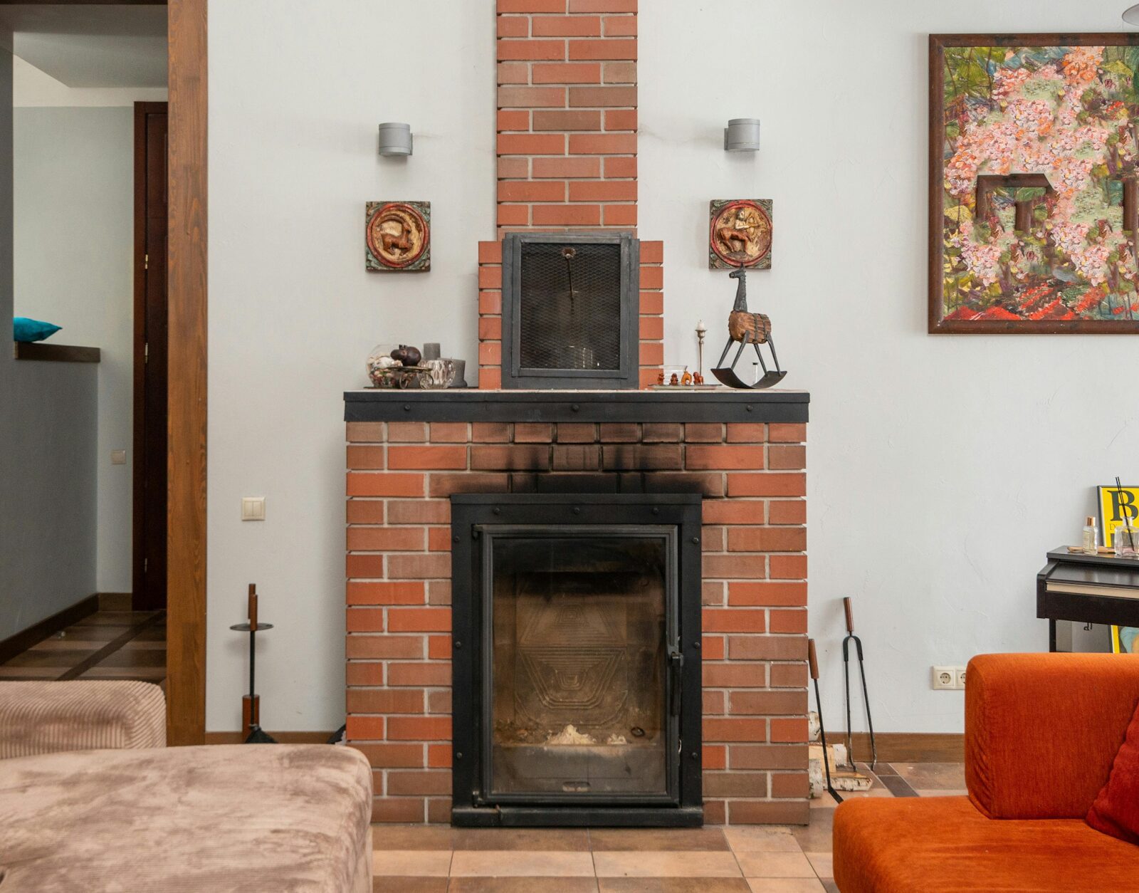 https://www.pexels.com/photo/brick-fireplace-near-couches-in-apartment-6296921/
