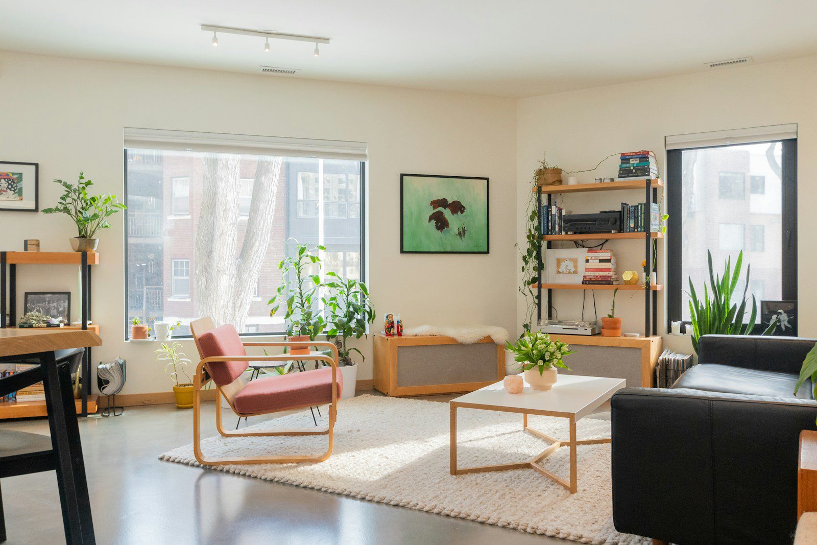 brown wooden chair near brown wooden table in light, open living room