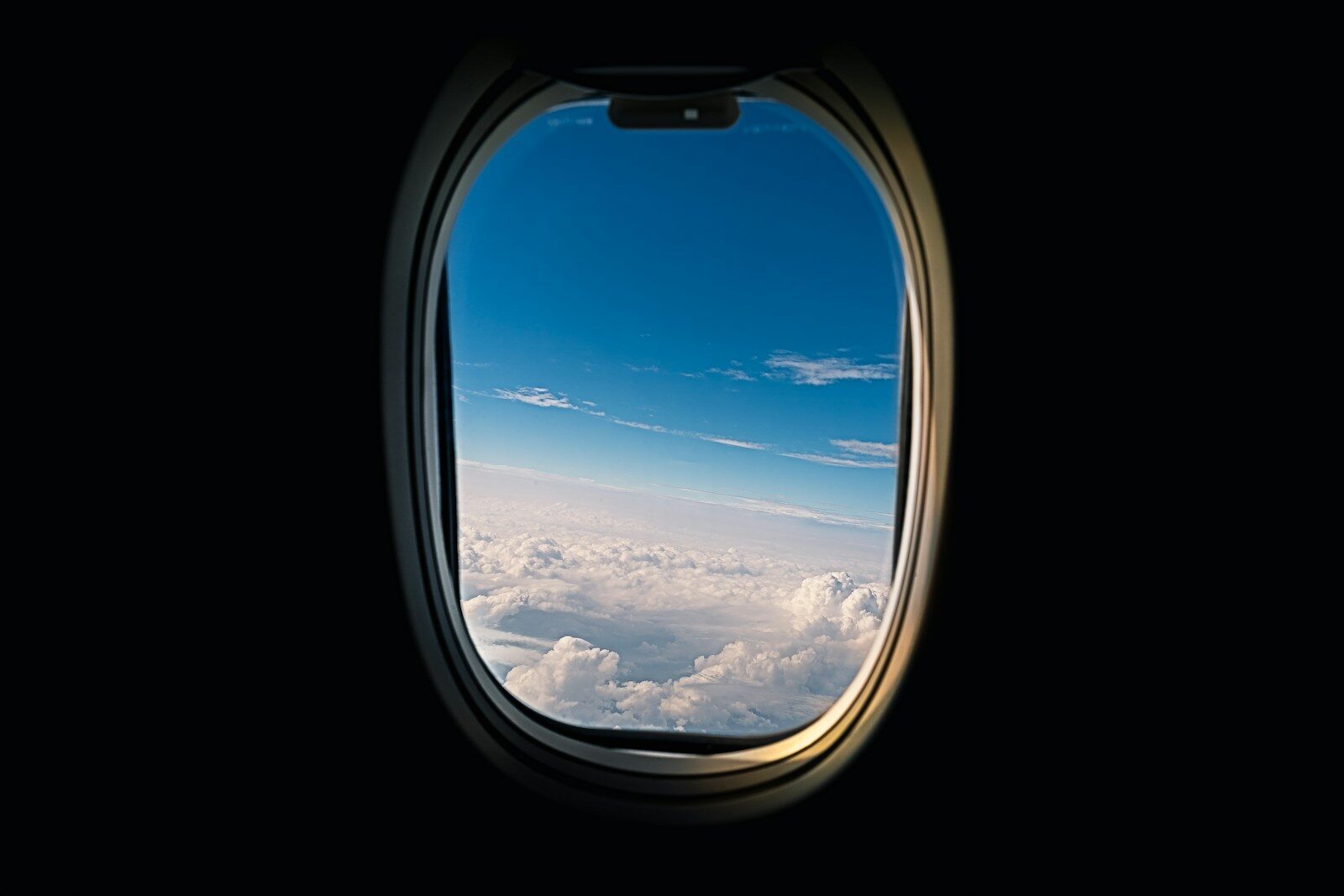 aeroplane window viewing white clouds
