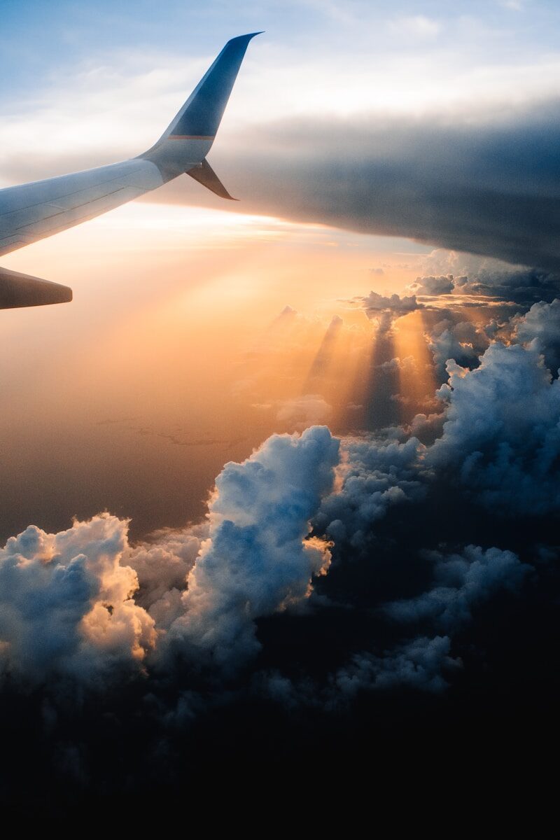 aeroplane oi sky during golden hour